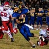 Tiger senior quarterback Sean Timmerman looks to create yardage at midfield against Brewster on Friday night. Despite a scoreless second half, the Bears beat Tonasket 21-13.