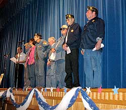 Tonasket High School students honored local veterans in a special assembly held last Friday, Nov. 9. Roger Castelda (far left) was one of several veterans gathered on the stage to speak with the students during the assembly.