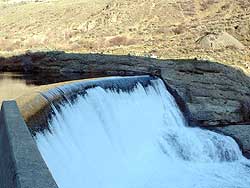 A view of the spillway of Enloe dam from the west bank of the Similkameen River. Okanogan County PUD recently released their Draft License Application to the Federal Energy Regulatory Commission for relicensing the hydroelectric dam.
