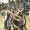 Photo by Terry MillsTigers Katy Keeton and April Webber make a tough defense against Omak.