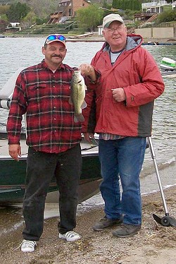 The big largemouth bass weighing 1.82 pounds was caught by the team of Jim Barker (left) and Cliff Applebee.