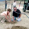 Photo by Gary DeVon<br>Developers Lisa and Jim Hammond plant one of the first barbera grape vines that will become the Veranda Beach Resort vineyard.