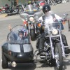 <p><i> Photo by Gary DeVon</i></p><p> Jackson Gregg, gets a ride in a sidecar from Verna Madison, a member of the Columbia River Harley Owner's Group. The fourth-grader, who had an operation last year for a brain tumor, was helped by the group which ra