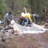 <p align="right"><i> Photos by Amy Veneziano</i></p><p>From left, Dave Sunde, Trygve Culp and Tom Winsor dump gravel on a newly-installed turnpike at the Antoine Trail last week. This spot is about a mile from Forest Service road access.</p>