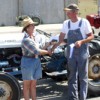 <div align="right"><em>Photo by Gary DeVon</em></div><p></p><p> Ellen Newton awards Mike Mulholland his first place championship ribbon for winning the Slow Tractor Race driving his 1962 Ford.</p>