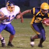 Photo by Terry Mills Hornet Nicky Perez scores a first down with 4:20 left in the first half against Tonasket on Oroville's home field.