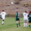 <p align="right"><em>Photo by Emily Hanson </em></p><p>Tonasket girls Shelby Olma (24) and Meghan Newton (4) racing to the ball against Liberty Bell’s Miranda Glenn (7) and Jennie Stahl (5) in the Thursday, Oct. 2 game. The Tigers lost to Liberty Bell 4
