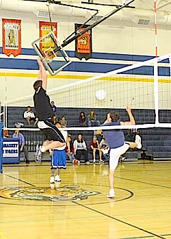 Photo by Terry MillsJunior Wade Detillian, on left, and Brandon Wahl and Josh McDaniel on the right during the juniors vs. seniors Macho Man Volleyball match on Wednesday, Nov. 12.
