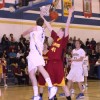 Photo by Terry MillsSenior Austin Olma of Tonasket tries to make a shot from under the hoop in Tonasket's game against Lake Roosevelt on Tuesday, Jan. 13. The Tigers lost, 66-39. Also shown are freshman Ty Egbert of Lake Roosevelt, senior Bryce Johnson (#