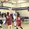Photo by Terry MillsTonasket's Jessica Kitterman shoots the ball in the Tigers' game against Lake Roosevelt on Tuesday, Jan. 13. The Tigers won with 3.8 seconds left 61-60. Also shown are Moyatat Bell-Bart and Tiffany Adkins from Lake Roosevelt and Dana P