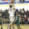 Tonasket senior Jeramy Dellinger jumps to make a shot over Joe Harris, a junior from Chelan, on Saturday, Jan. 31 Tonasket lost 81-42.Photo by Terry Mills