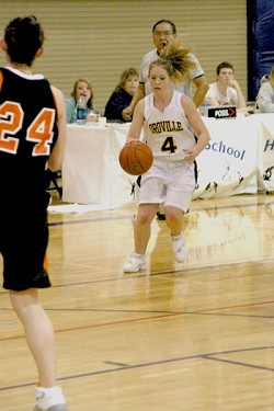 The Lady Hornet's Kayla McKinney brings the ball down court against the Entiat Tigers. McKinney, a 5'5