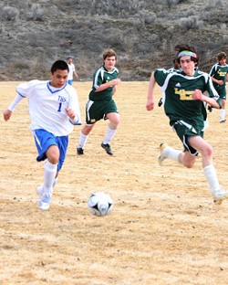 Photo by Terry MillsFreshman Kevin Aitcheson kicking the ball down the field against Liberty Bell on Thursday, March 19 in Tonasket’s first boys’ soccer game of the spring sports season.