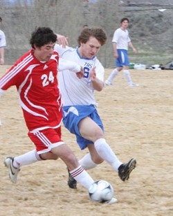 Photo by Terry MillsTonasket sophomore Keegan McCormick tries to steal the ball from a Brewster player during the soccer game on Tuesday, March 24. Tonasket lost at home to Brewster 8-0.