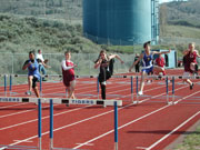 Photo by Emily HansonTeriqua Cholmondelely (left) and Vanessa Martinez (right), both from Tonasket, running in the women’s 100 m 33” hurdles during the Tonasket Invitational Track meet on Friday, April 17. Cholmondelely finished in first place and Mar