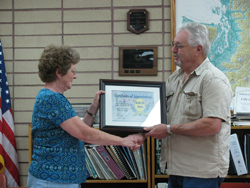 Oroville City Clerk/Treasurer Kathy Jones being honored by Oroville Mayor Chuck Spieth for 35 years of dedicated service to the city. Photo by Emily Hanson