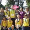The Scent of 12 team of Tonasket women at the Second Annual Spokane to Sandpoint Relay finish line. The team came in second place with a time of 28 hours and 27 minutes and was composed of 12 women with connections to Tonasket and one driver: Bobbi Catone