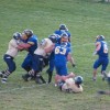 Junior running back Keegan McCormick (6) makes his way past Bow Valley defensive linemen as the Tigers block for him during Tonasket’s 48-34 victory over the Canadian team. Also shown is junior defensive lineman Stephen Hulse (63).Photo by Emily Hanson