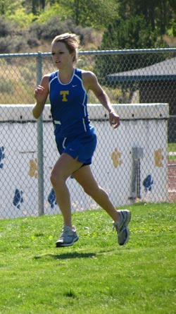 Jessica Spear of Tonasket beginning her second lap on the Tonasket course during the cross country meet on Saturday, Sept. 12. Spear finished in fourth place with a time of 20:53.Photo by Emily Hanson