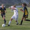 Tonasket’s Michelle Timmerman (middle) pulls back to kick the ball between Oroville’s Naomi Peters (21) and Catie Arrigoni during the Tigers’ home game against the Hornets on Tuesday, Sept. 8. The game ended in a 4-4 tie.Photo by Terry Mills