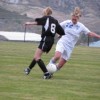 Tonasket’s Michelle Timmerman works to steal the ball from Omak’s Rachel Riggle during Tonasket’s home game against Omak on Tuesday, Oct. 13. The Tigers lost 4-3. Photo by Emily Hanson
