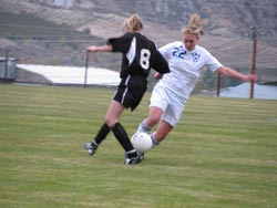 Tonasket’s Michelle Timmerman works to steal the ball from Omak’s Rachel Riggle during Tonasket’s home game against Omak on Tuesday, Oct. 13. The Tigers lost 4-3. Photo by Emily Hanson
