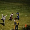 Tonasket sophomore running back John Stedtfeld scoring the fifth Tonasket touchdown during the Tiger’s game with the Lake Roosevelt Raiders on Friday, Oct. 16. Also shown is Raider freshman linebacker Shawn Waters, who was unable to stop Stedtfeld’s f