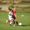 Tonasket freshman Kelly Cruz works on stealing the ball from a Brewster girl during Tonasket’s home win on Tuesday, Sept. 22.Photo by Emily Hanson