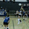 Tonasket junior Brooke Ray jumps up to hit the ball over the net during Tonasket’s home game against Omak on Tuesday, Sept. 29. Also shown are junior Jessica Rhoads (#11), sophomore Amber Kilpatrick (#3) and sophomore Taylor Ayers (#2).Photo by Emily Ha