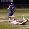 Tonasket junior running back Keegan McCormick runs toward the end zone for the first touchdown of the night, scored 23 seconds into the game, as the last Brewster defender with a chance of stopping him, freshman defensive back Danny Ramirez, falls to the