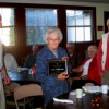 Richard Rise, President of OCHS, presents Claire Rise with the Pioneer of the Year award as Mary Louise Loe, president of the Molson Museum looks on.