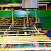 In addition to taking lumber and other goods trucked from Canada and placing it on railcars, the "Reload" in the Oroville Reman and Reload name, the company also resaws and finishes lumber products, the "Reman" in their name. Photo by Gary DeVon