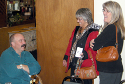 Rep. Joel Kretz talks with Oroville Chamber of Commerce Members Patty Garret and Peggy Shaw following their Friday, Nov. 13 meeting in Oroville. Photo by Gary DeVon