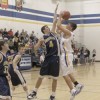 Tonasket junior Zach Neal shoots the ball over Oroville senior Brandon Funston during Tonasket’s home victory over Oroville on Tuesday, Dec. 8. Photo by Terry Mills