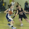 Tonasket junior Shelby Olma looks for a teammate to pass to past Cashmere senior Shelby Holt during Tonasket’s home game against Cashmere on Saturday, Jan. 9. Photo by Emily Hanson