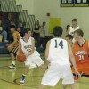 Tonasket junior Corbin Moser looks for an open teammate to pass the ball to during the Tigers’ home loss to Cashmere on Saturday, Jan. 9. Also shown is senior Blake Long (14) and junior Zach Neal. Photo by Emily Hanson