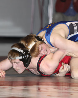Tonasket junior Lee Leavell, wrestling in the 145 pound weight class, holds his Okanogan opponent, Ryan Kells, in control during Tonasket’s meet in Okanogan on Thursday, Jan. 21. Leavell pinned Kells in the second round with four seconds left. Photo by 