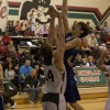 Tonasket junior Colton Ayers tries to make a shot over a Chelan Goat during the Tigers’ away game against Chelan on Saturday, Jan. 30. Photo by Les Bowen