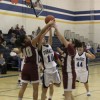 Tonasket junior Michelle Carlson tries to make a shot despite some Okanogan Bulldog’s best efforts to tip it during Tonasket’s home game on Tuesday, Feb. 2. Photo by Terry Mills