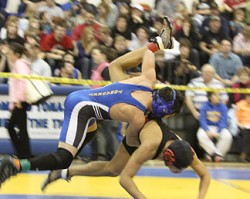 Tonasket junior Tyler Laurie flips Deshawn Dunham from Omak in the air during the second round of the Regional Wrestling Tournament held in Tonasket on Saturday, Feb. 13 in the 130 weight class. Laurie went on to become the Regional Champion at 130 pounds
