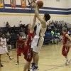 Tonasket senior Wade DeTillian makes a jump shot against Omak during the Tigers’ last home game of the season on Tuesday, Feb. 9. Photo by Terry Mills
