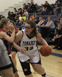 Tonasket junior Jayden Hawkins moves the ball toward the basket during the Lady Tigers’ final home game of the season on Tuesday, Feb. 9. Photo by Terry Mills