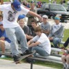Mo Brown, competing in the 11 to 17 year old age group, rides the rail as the crowd watches at the First Annual T-Town SK8 Throwdown on Saturday, May 22. Brown finished in seventh place in his age group. Photo by Emily Hanson