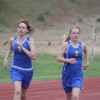 Tonasket sophomore Kyndra Dellinger (left) and junior Jessica Spear running together in the 1600 meter race at the District Six 1A Championship on Friday, May 21. Spear finished in second place at 5:46.85, qualifying her for a trip to the state meet, whil