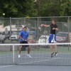 Tonasket senior Karl Bharucha (left) stays ready for his Okanogan opponents to send the ball back his way after his teammate, senior Damon Sprague, sent it flying over the net. Bharucha and Sprague won the match 6-1, 6-3 but lost in the finals match to th
