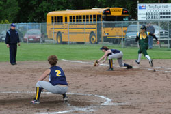 Lady Hornet Chandra Hutsell stretches to make the forced out at first base a close call going against the Liberty Bell runner. Photo by Gary DeVon