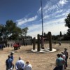 Many people gathered to listen to speeches and celebrate the raising of the American Flag on the 50-foot flagpole at the U.S. Armed Forces Legacy Project. Photo by Gary DeVon