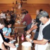 Oroville School Board members serve ice cream to elementary school students and their parents following an open house last Monday evening, Aug. 30, the first day of school for the Oroville School District. Photo by Gary DeVon