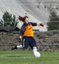 Tonasket freshman goalie Christa McCormick kicks the ball away from the goal during the Tigers’ home game against Oroville on Saturday, Sept. 11. Photo by Emily Hanson