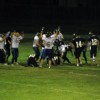 The Tonasket Tigers celebrate in Kettle Falls after junior quarterback John Stedtfeld scored the winning touchdown during overtime on Friday, Sept. 10. Photo by Emily Hanson